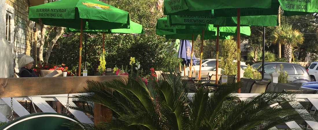 Patio seating at Palm Coast Coffee on a beautiful day.